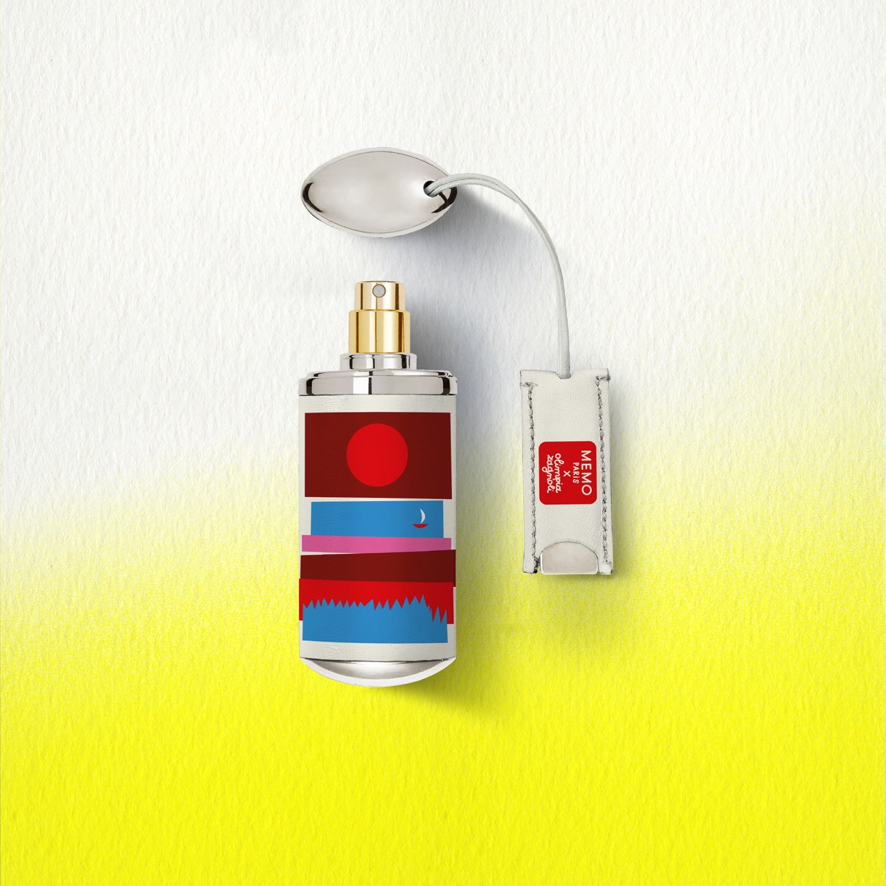 A sleek cylindrical cap camarat perfume bottle by memo paris with metallic cap and bold red blue white stripes — vue alternative