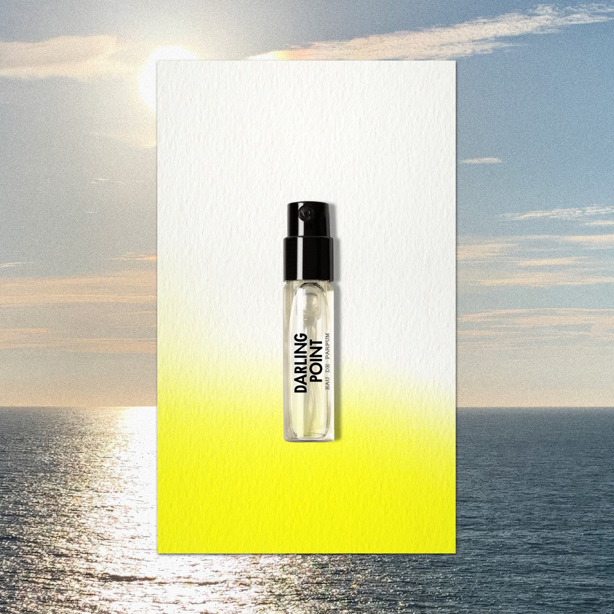 Clear glass travel spray bottle with black cap and minimalist darling point branding containing light fragrance for portobello road